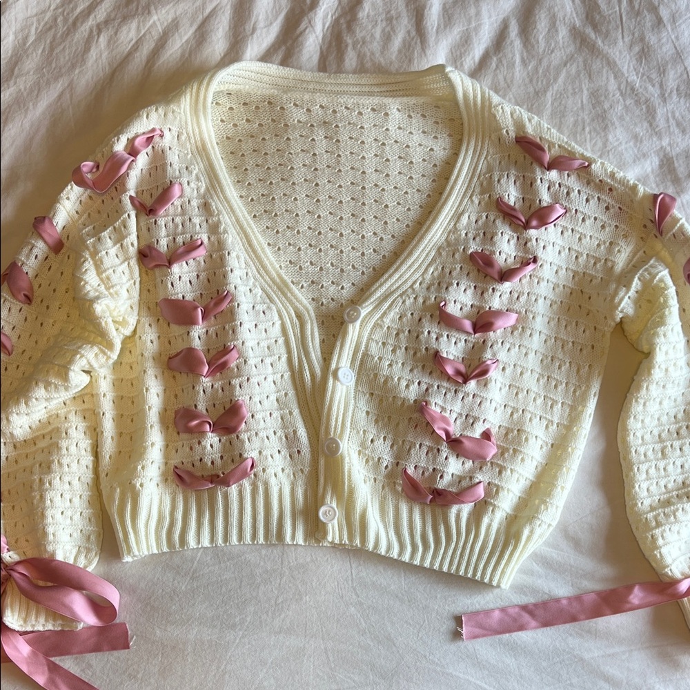 Elegant Cream Cardigan with Pink Ribbon Accents